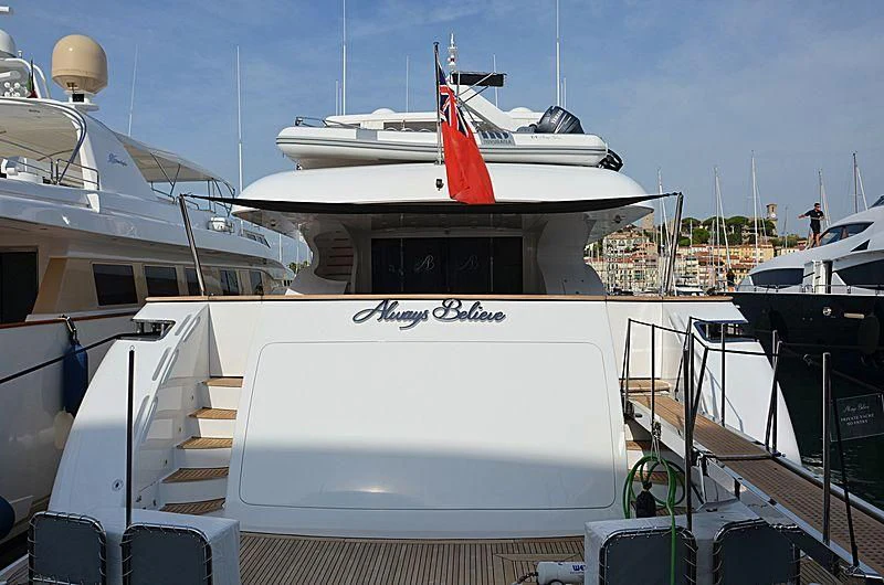 a boat docked at a pier aboard ALWAYS BELIEVE Yacht for Sale