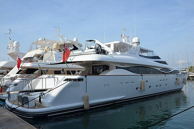 a white yacht docked aboard ALWAYS BELIEVE Yacht for Sale