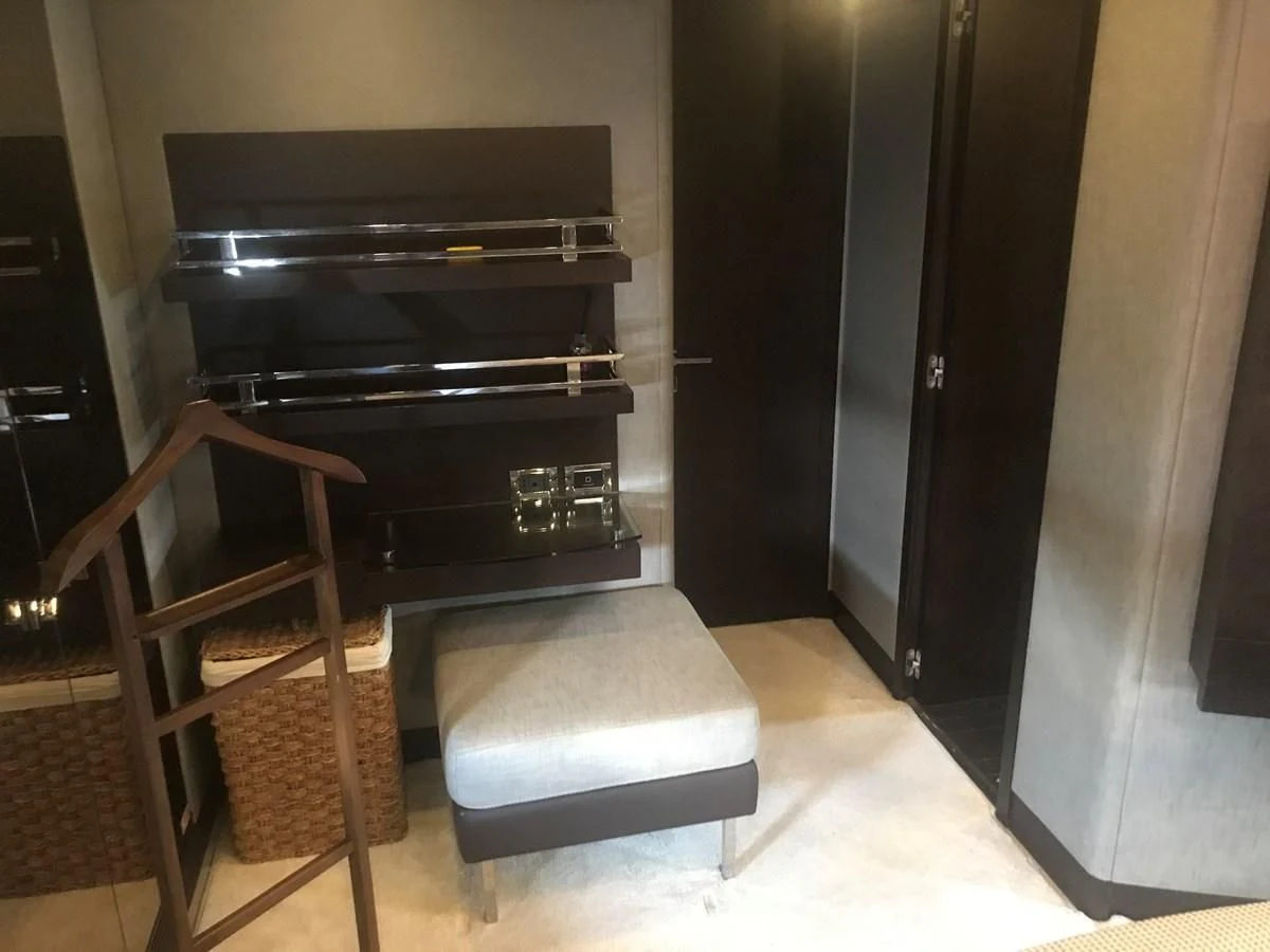 a chair next to a fireplace aboard PATRIOT Yacht for Sale