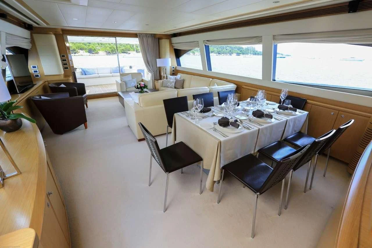a conference room with a table and chairs aboard ONYX Yacht for Charter