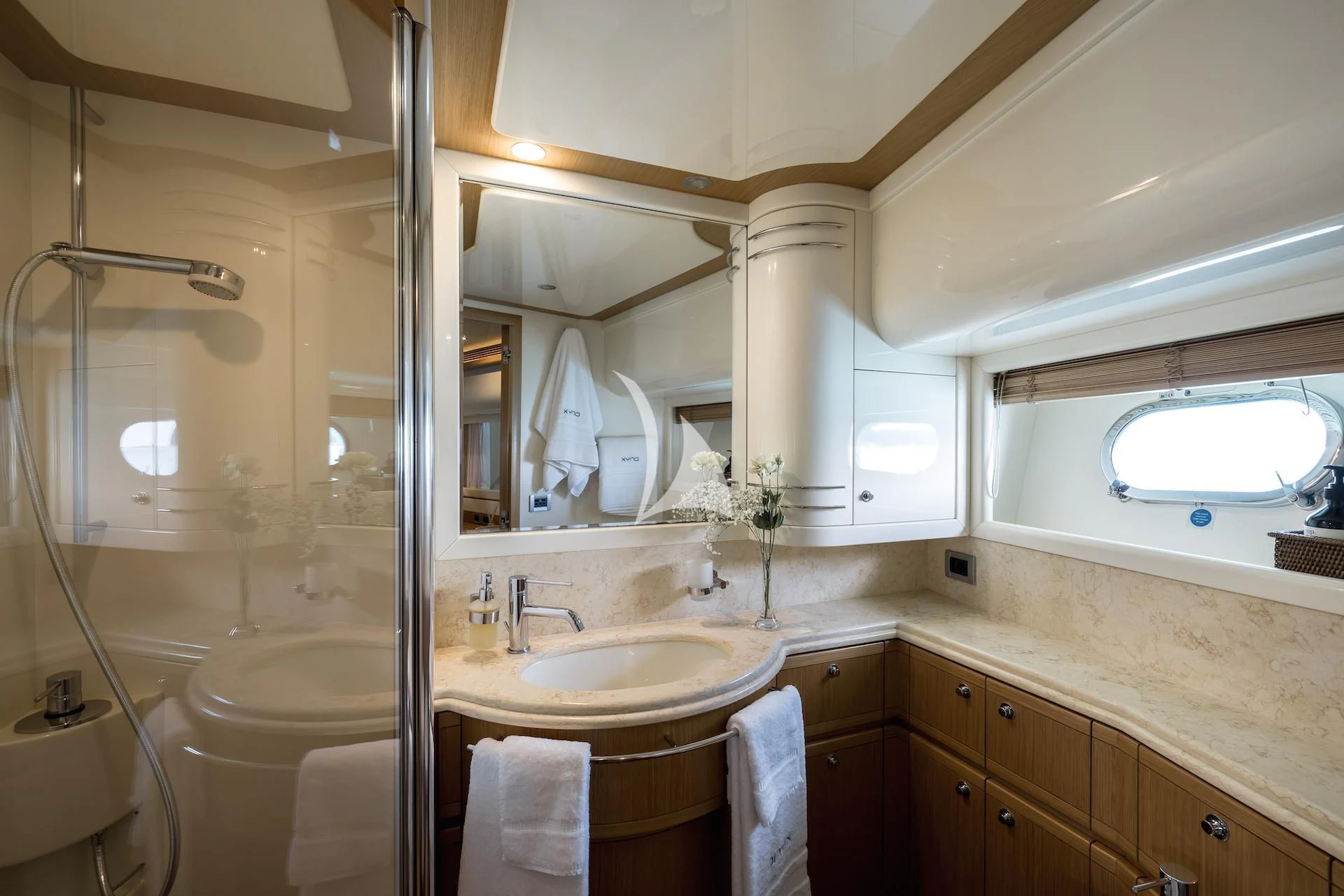 a bathroom with a large mirror aboard ONYX Yacht for Charter