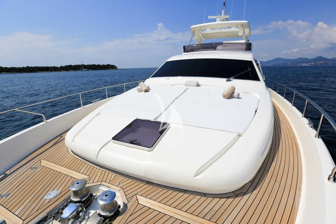a white yacht on a dock aboard ONYX Yacht for Charter