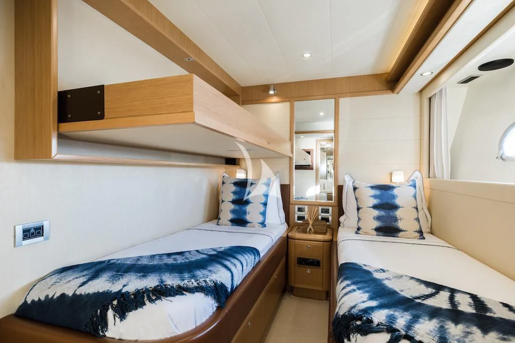 a room with two beds aboard ONYX Yacht for Charter