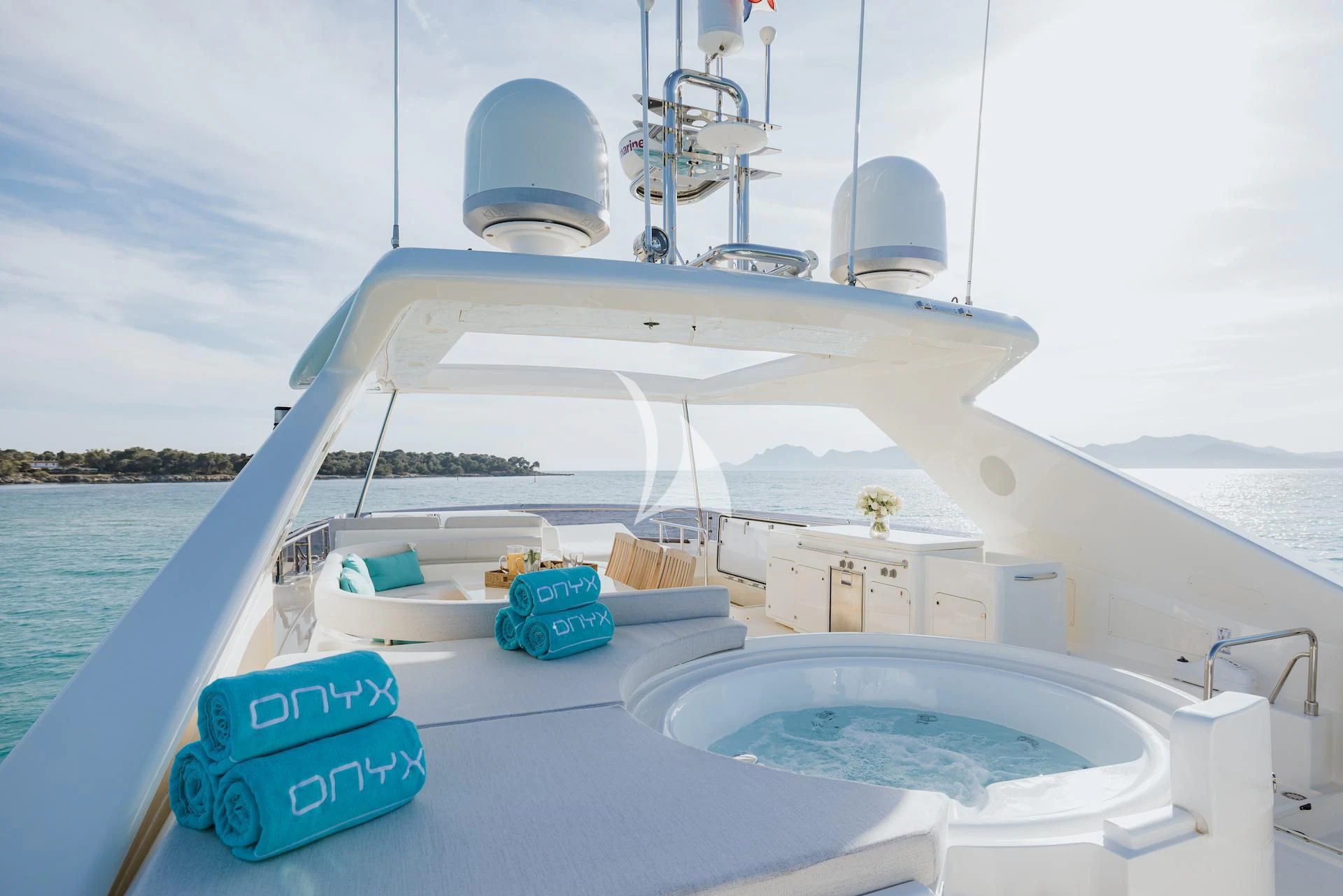 a boat with a couple of blue and white items on it aboard ONYX Yacht for Charter