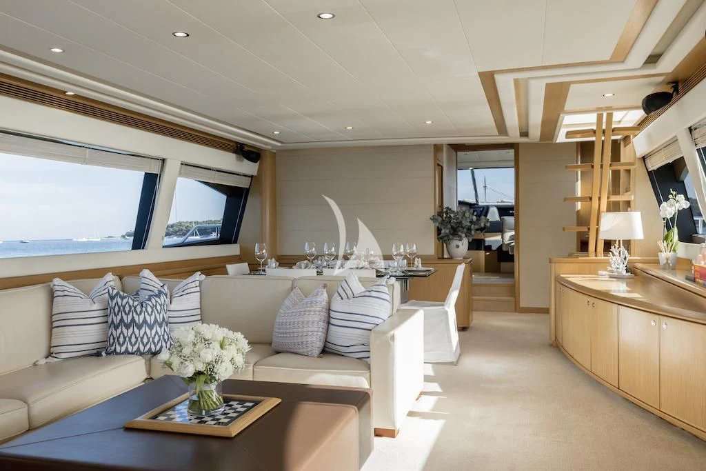 a living room with a couch and a coffee table aboard ONYX Yacht for Charter