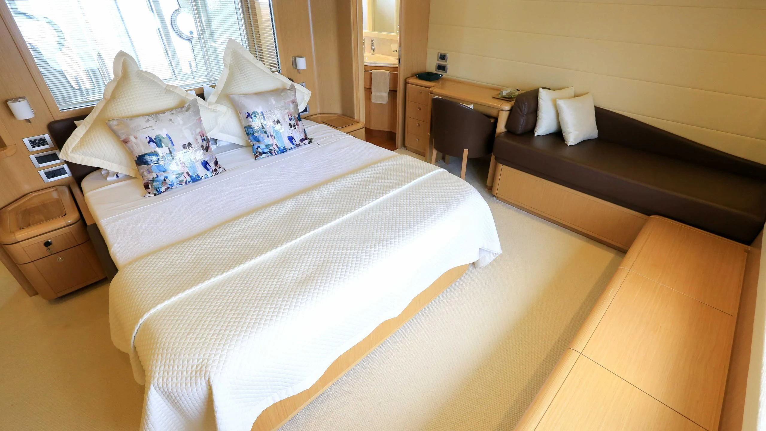 a bed with white sheets aboard ONYX Yacht for Charter