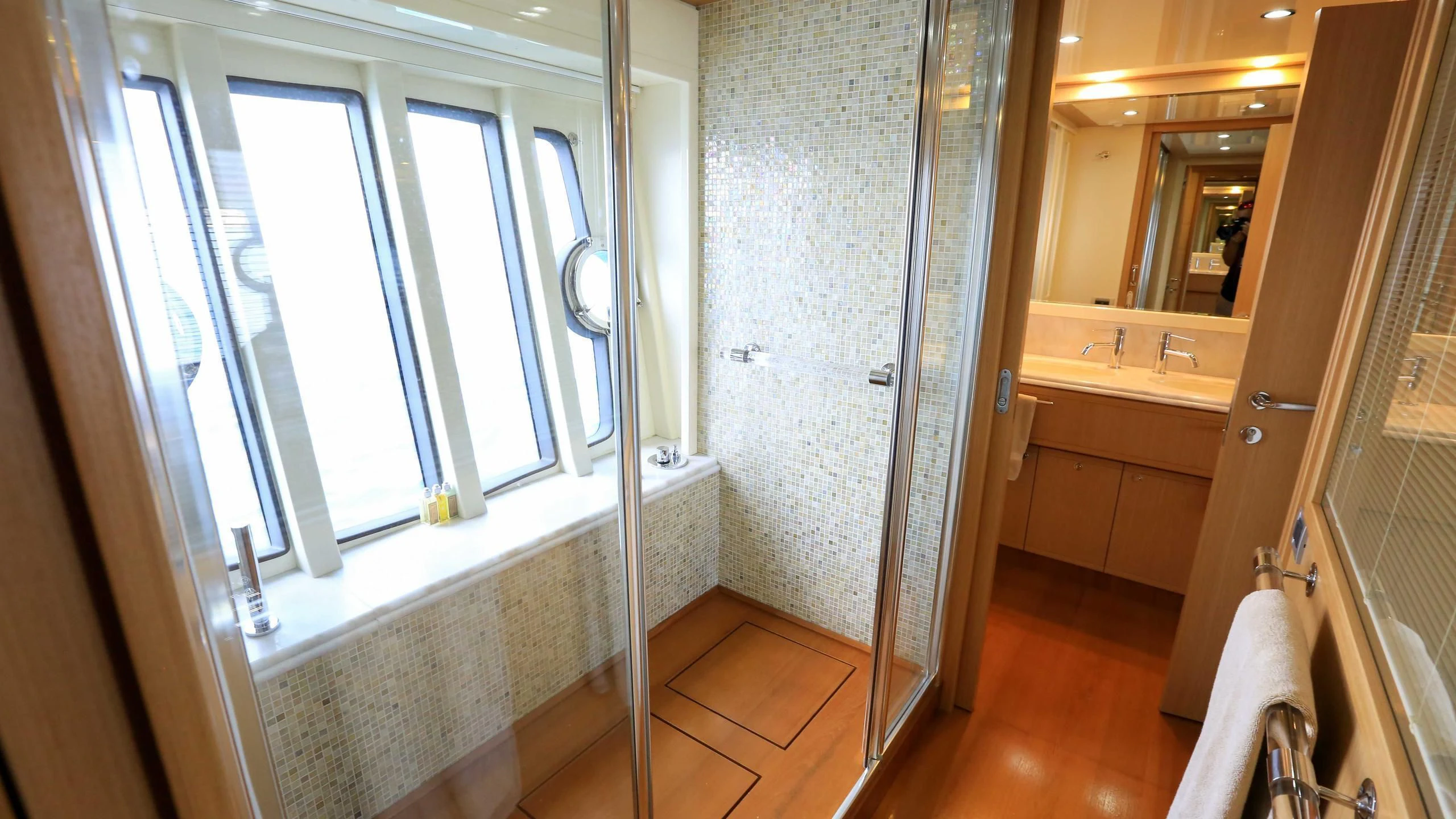 a bathroom with a shower and sink aboard ONYX Yacht for Charter