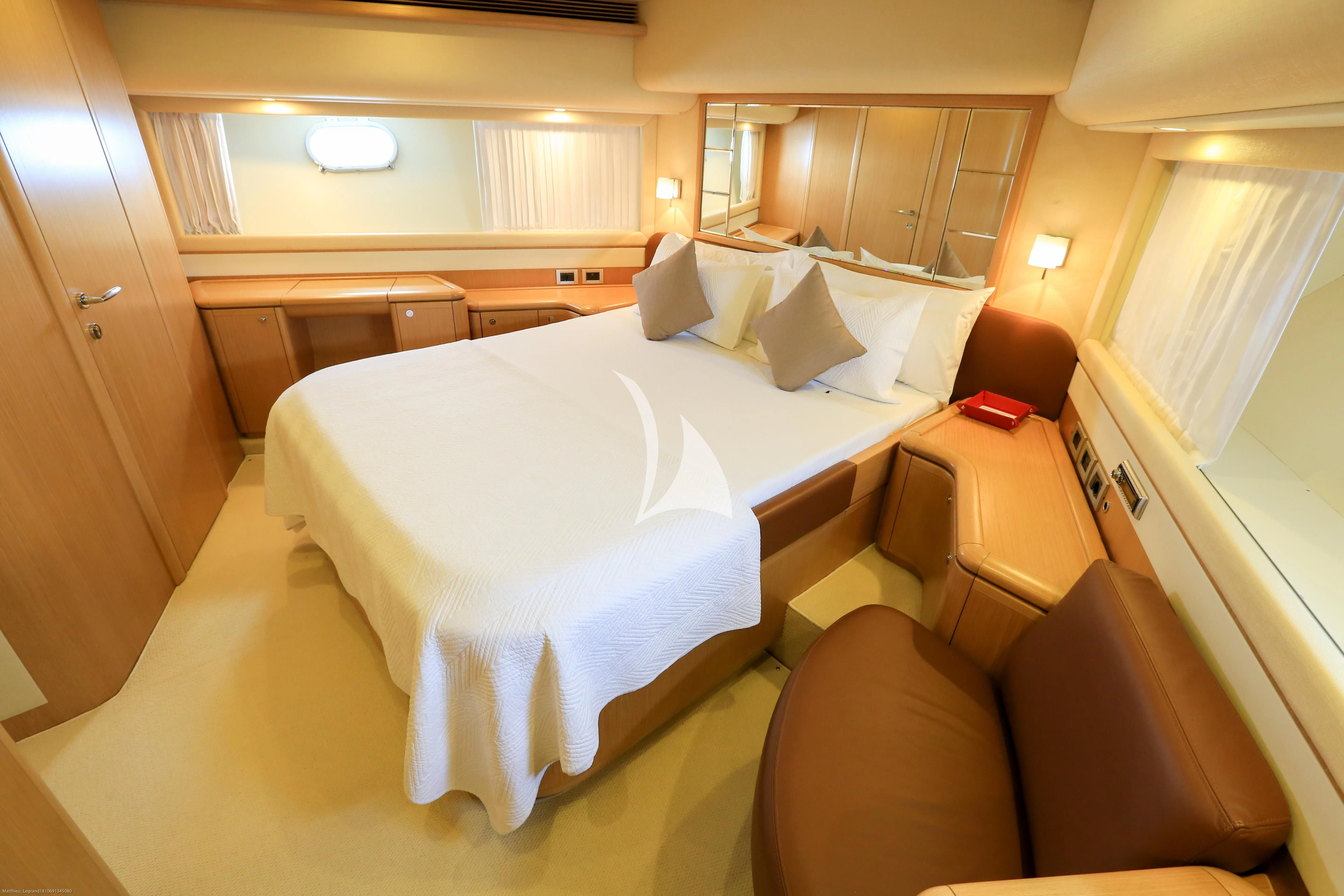 a bed in a room aboard ONYX Yacht for Charter