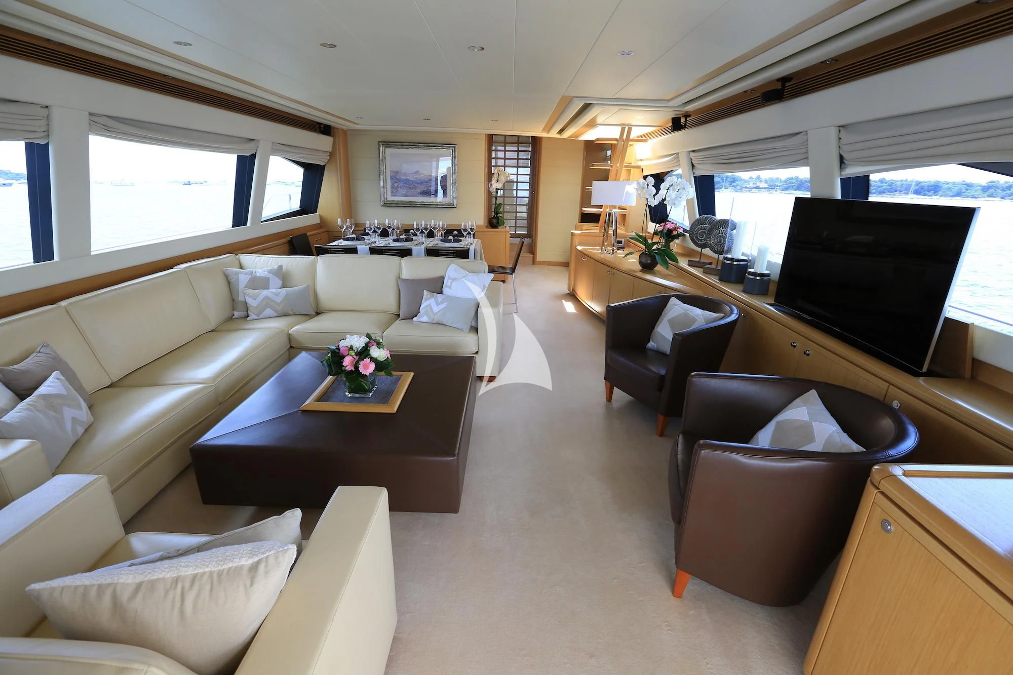 a living room with a couch and a television aboard ONYX Yacht for Charter