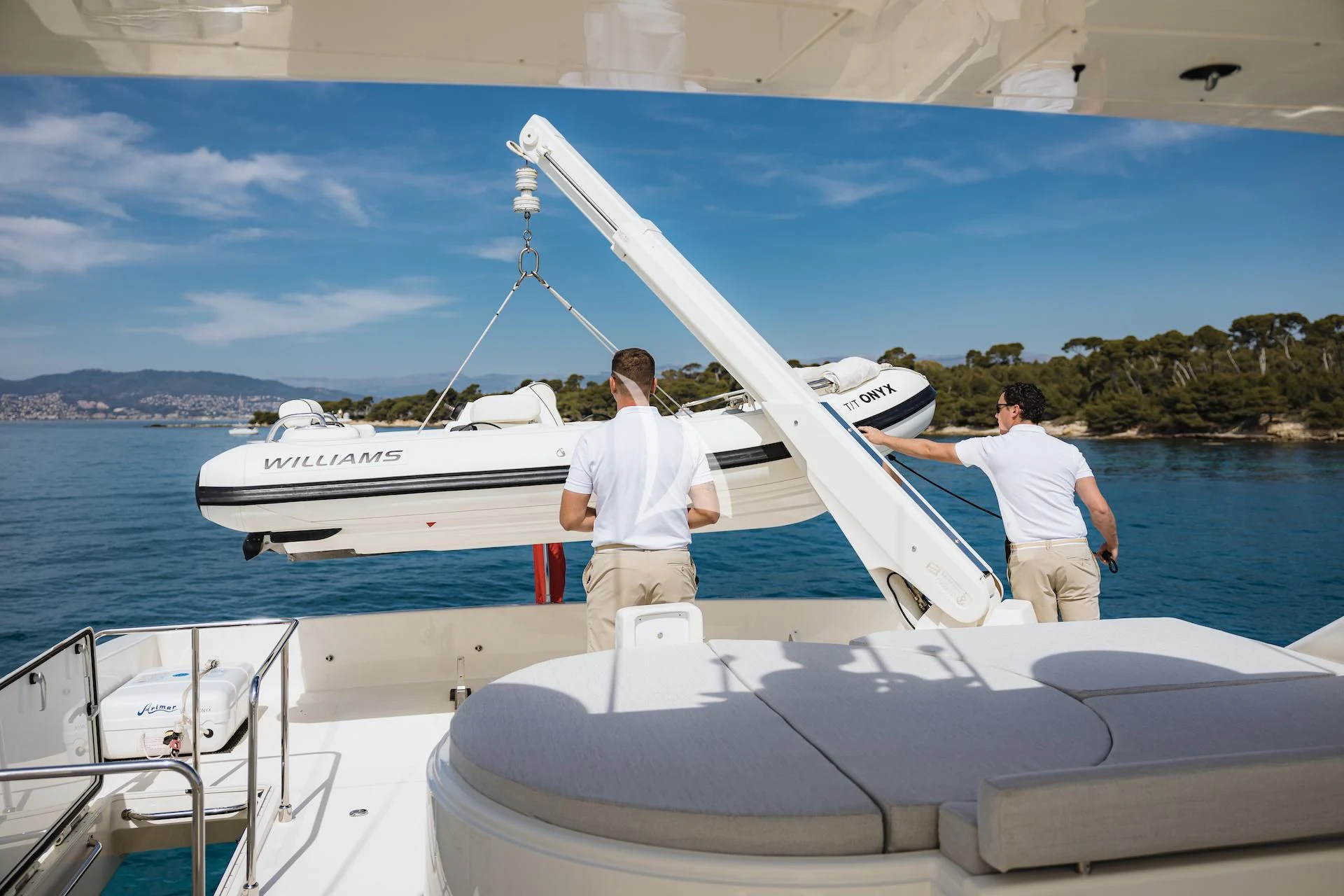a couple of men on a boat aboard ONYX Yacht for Charter