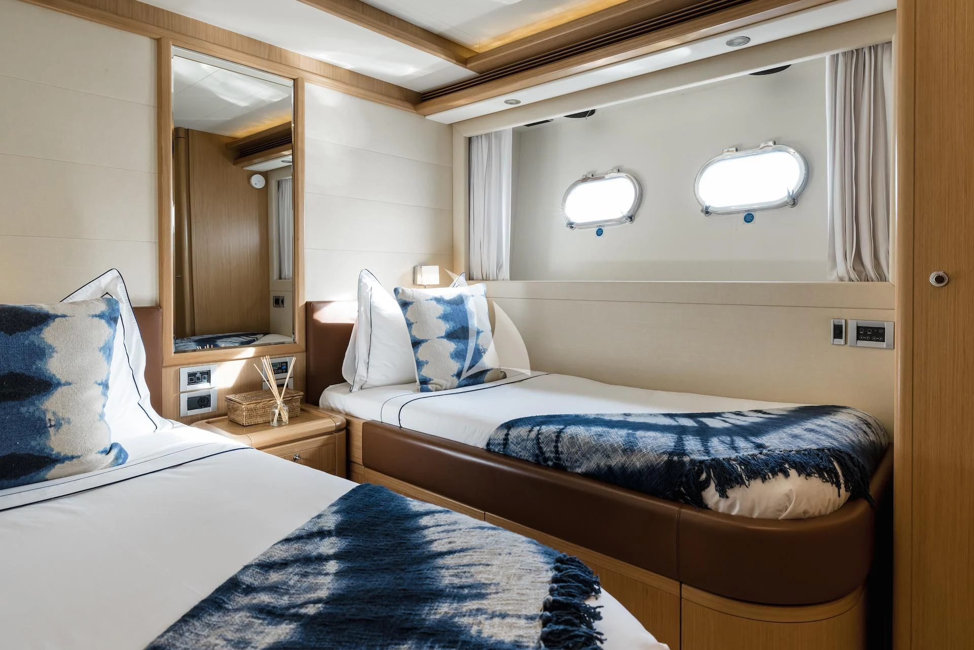 a couple of beds in a hotel room aboard ONYX Yacht for Charter