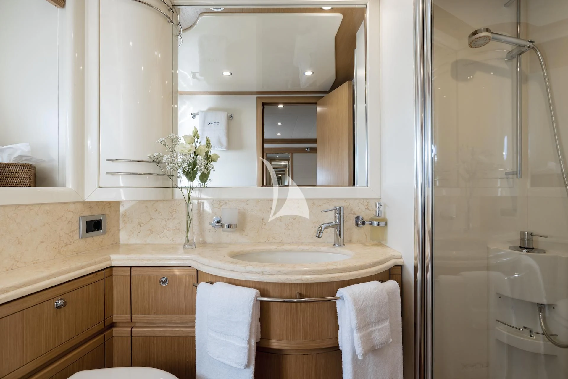 a bathroom with a sink and a mirror aboard ONYX Yacht for Charter