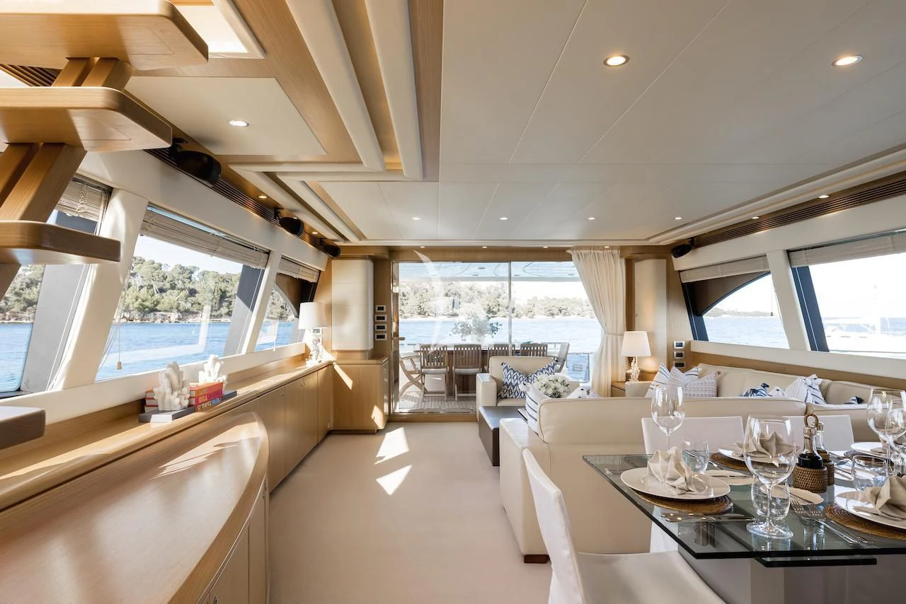 a room with a table and chairs aboard ONYX Yacht for Charter