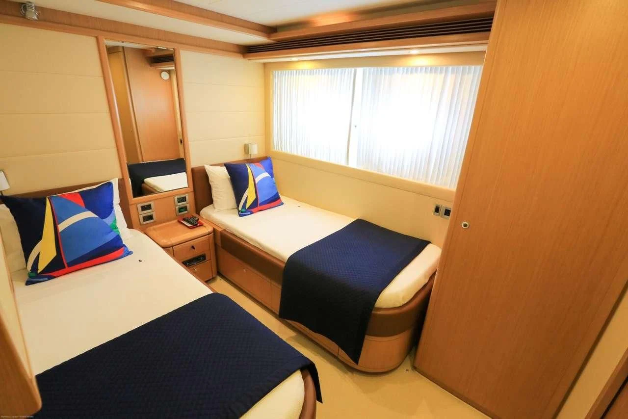 a room with two beds aboard ONYX Yacht for Charter