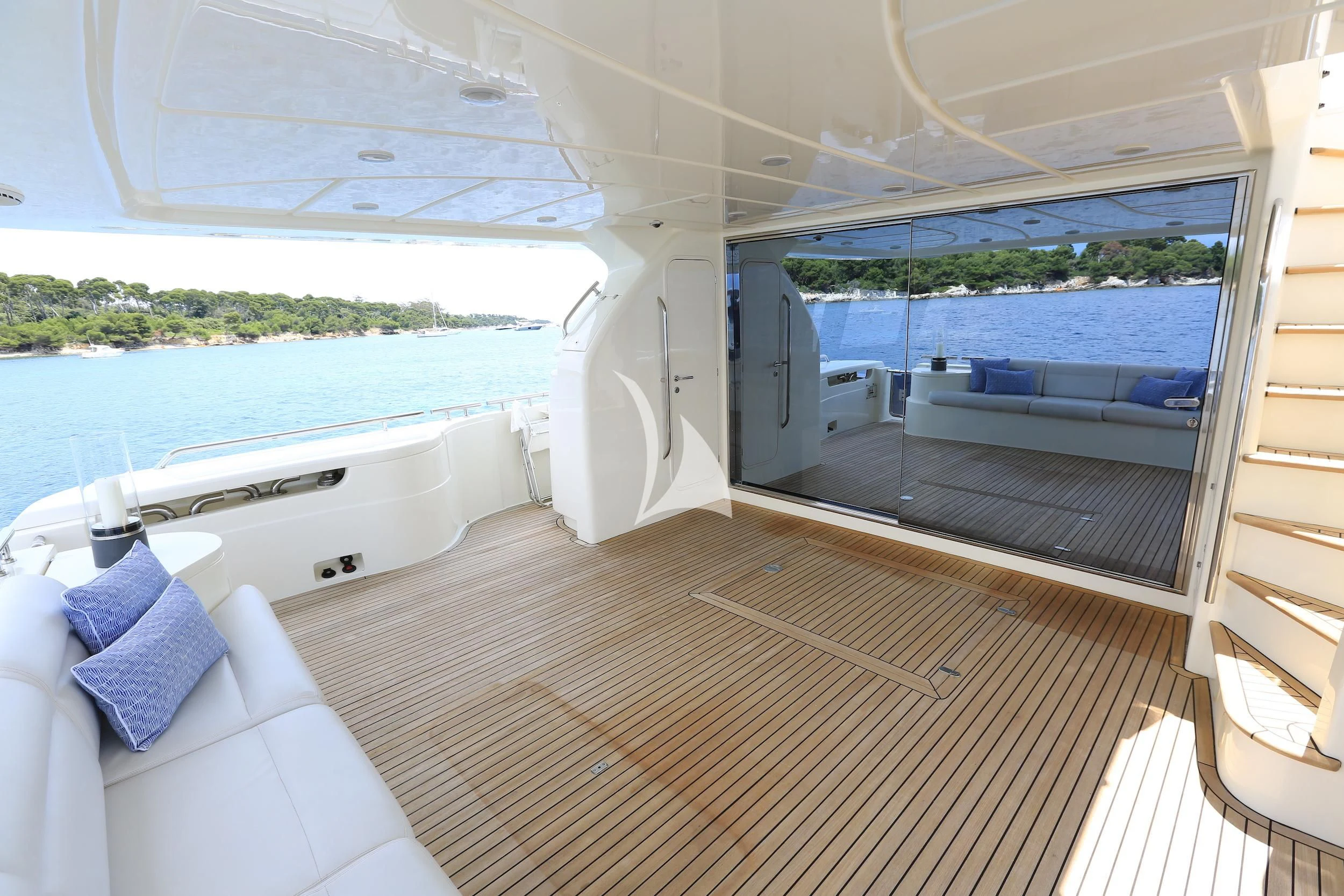 a room with a bed and a large window aboard ONYX Yacht for Charter