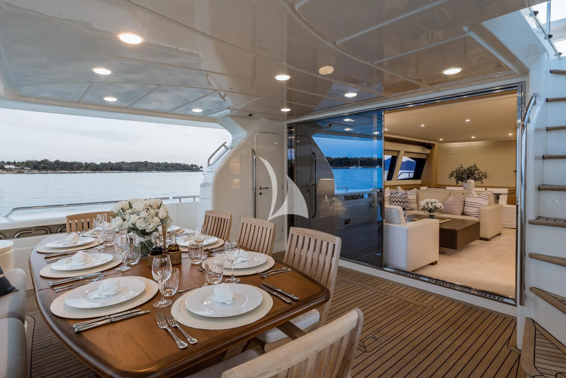 a dining room with a large window aboard ONYX Yacht for Charter