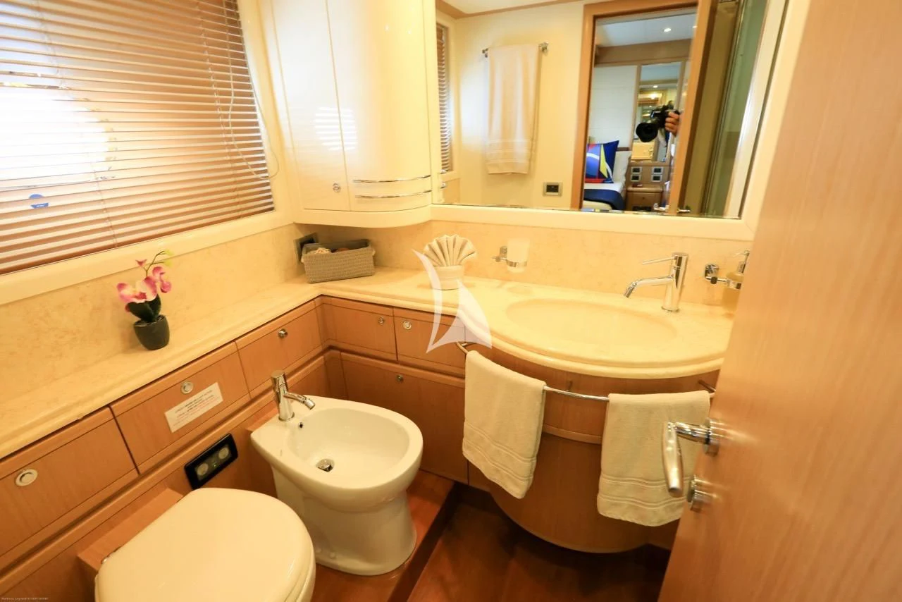 a bathroom with a sink and toilet aboard ONYX Yacht for Charter