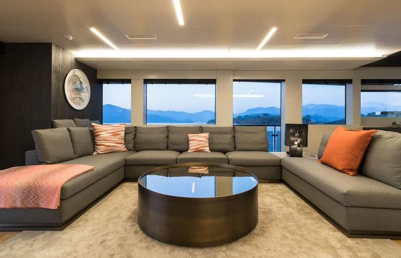 a living room with a couch and a table aboard MARLA Yacht for Sale