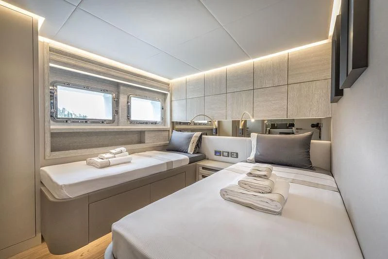 a room with a bed and a television aboard MARLA Yacht for Sale