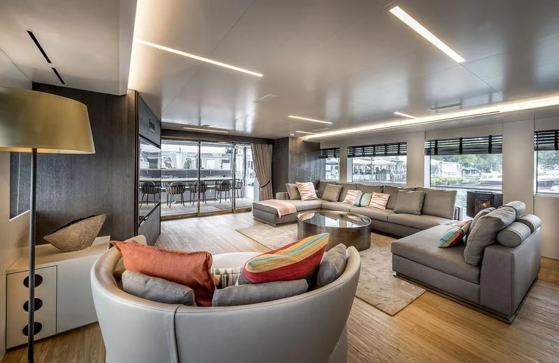 a living room with a couch and a lamp aboard MARLA Yacht for Sale