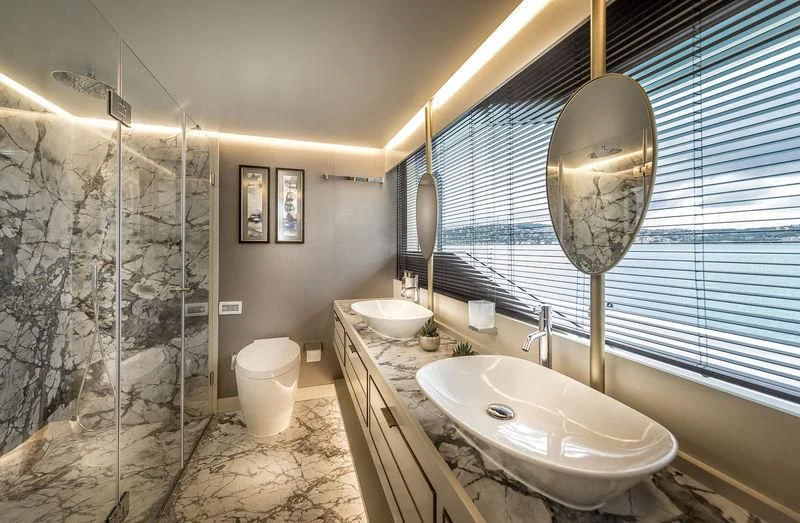 a bathroom with a large mirror aboard MARLA Yacht for Sale