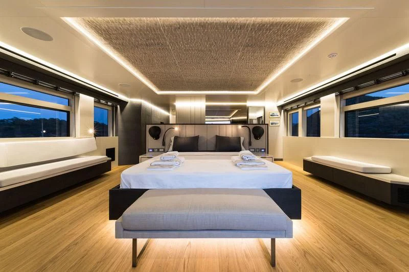 a room with a bed and a couch aboard MARLA Yacht for Sale