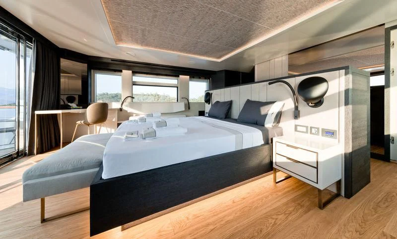 a room with a bed and a desk aboard MARLA Yacht for Sale