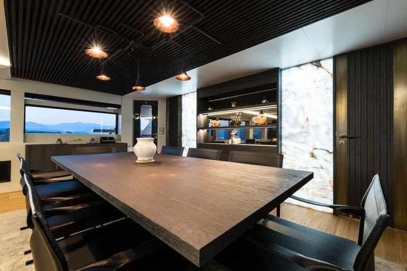 a large table with chairs around it aboard MARLA Yacht for Sale