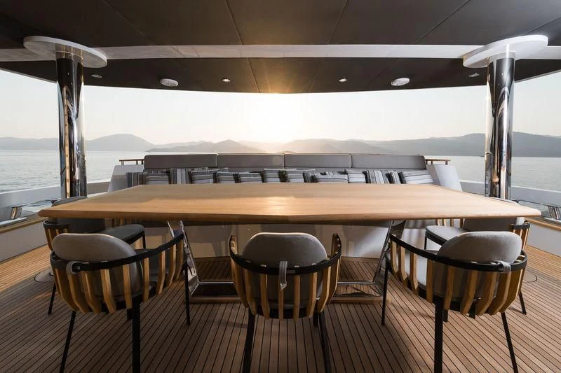 a table with chairs around it aboard MARLA Yacht for Sale