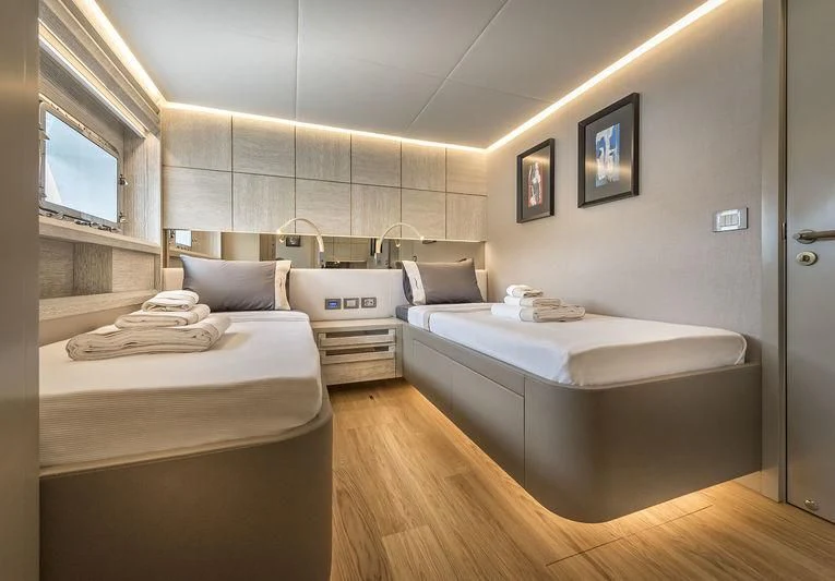 a room with two beds aboard MARLA Yacht for Sale