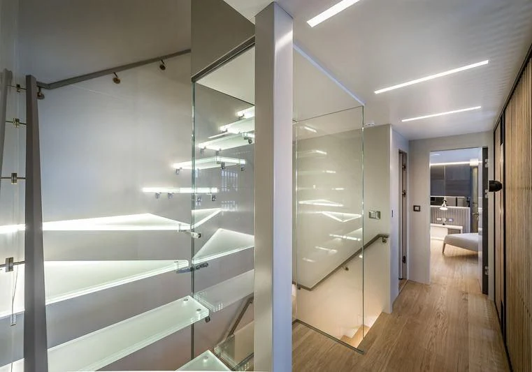 a room with glass walls and a staircase aboard MARLA Yacht for Sale