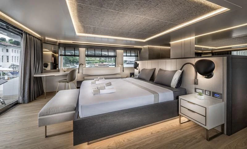 a large bedroom with a large bed aboard MARLA Yacht for Sale