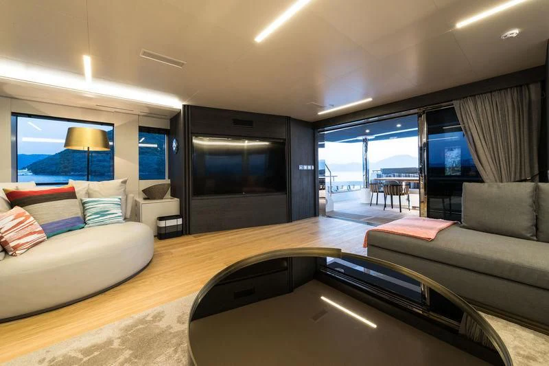 a living room with a large window aboard MARLA Yacht for Sale