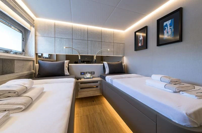 a room with beds and a window aboard MARLA Yacht for Sale