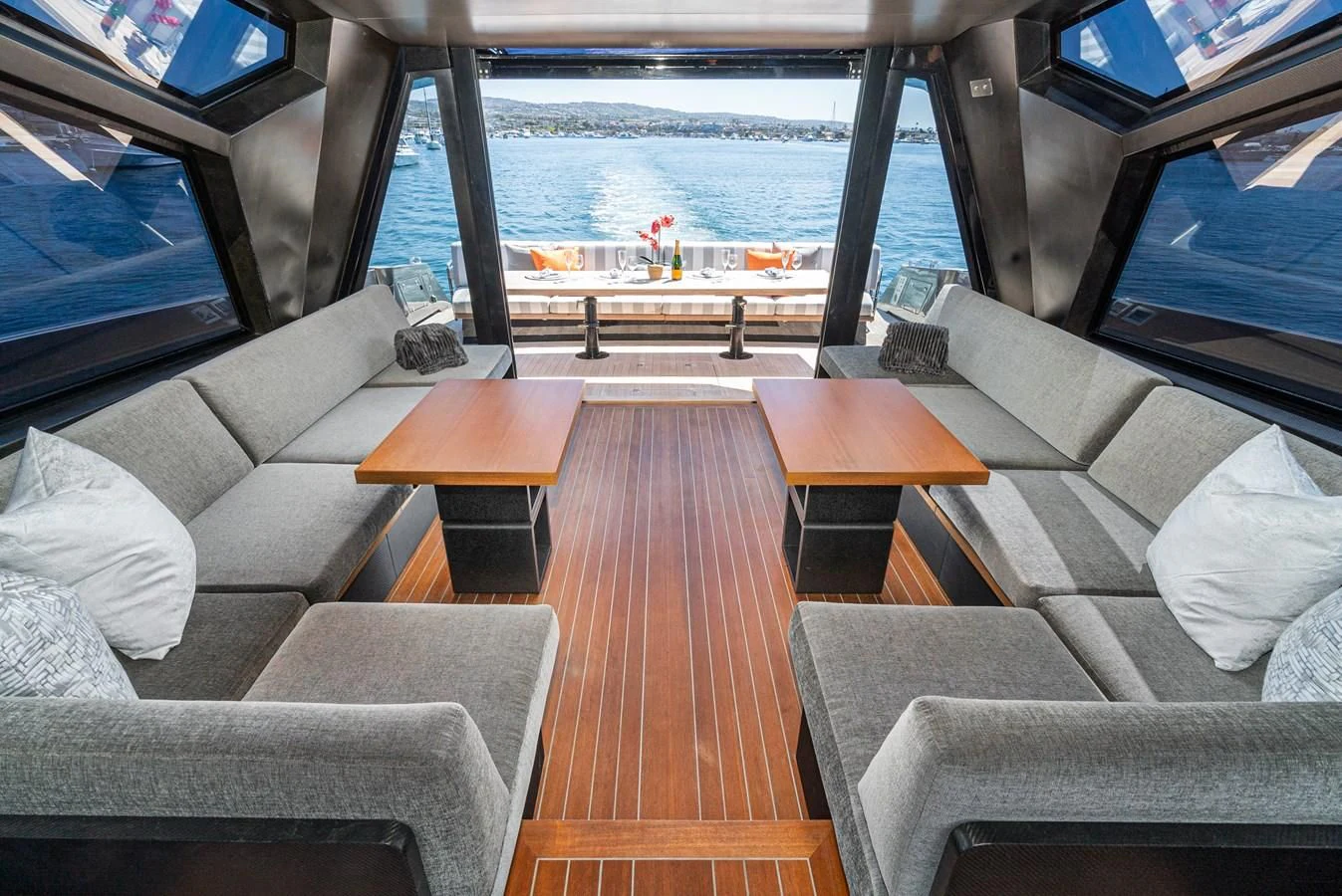 a living room with a large window aboard AIFOS Yacht for Sale