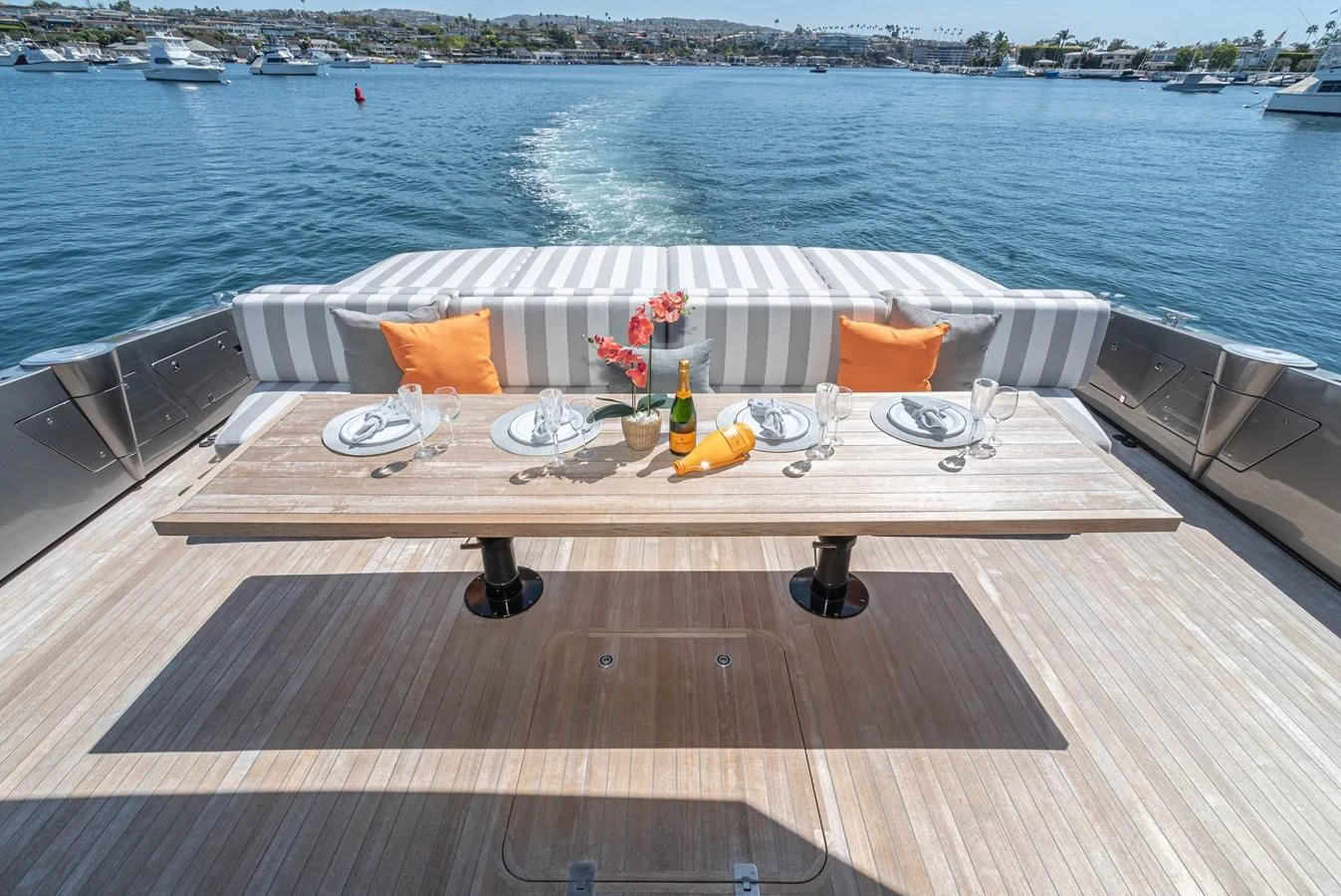 a deck with a bottle and a can on it aboard AIFOS Yacht for Sale