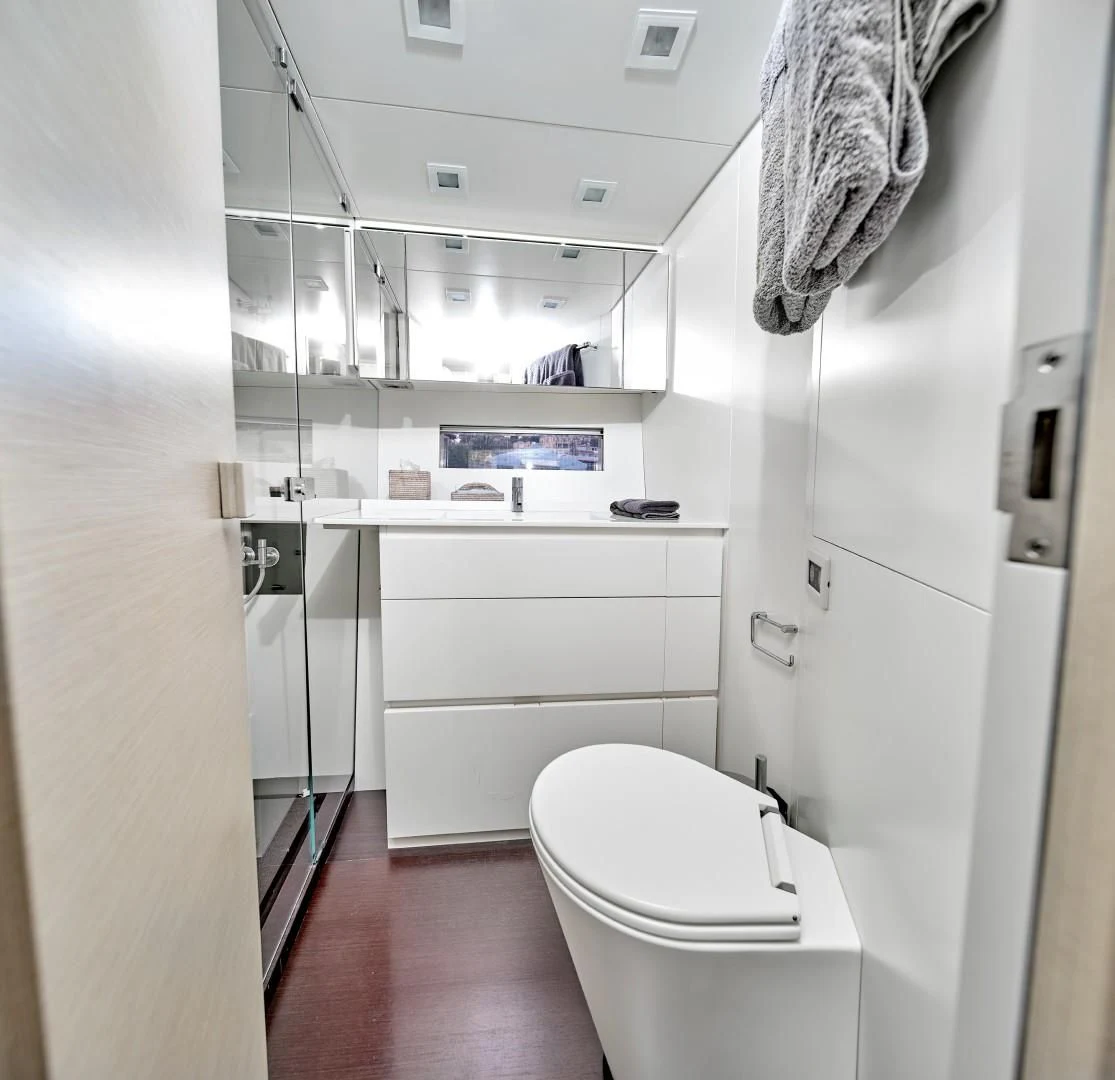 a bathroom with a toilet and sink aboard AIFOS Yacht for Sale