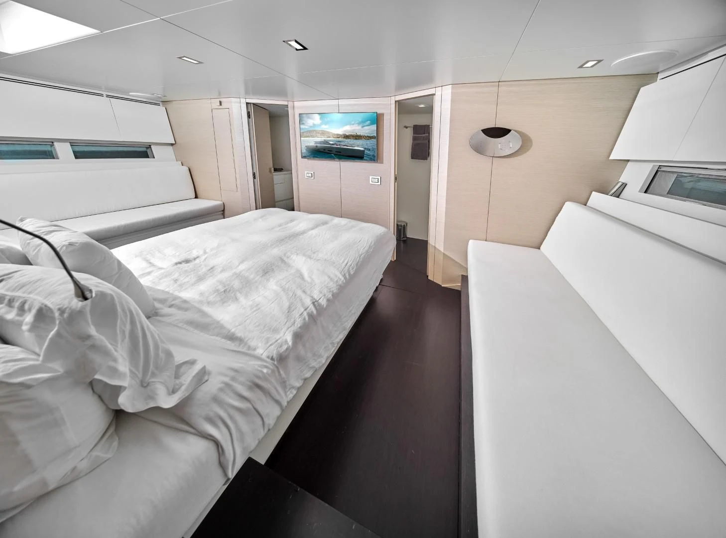 a room with white beds aboard AIFOS Yacht for Sale