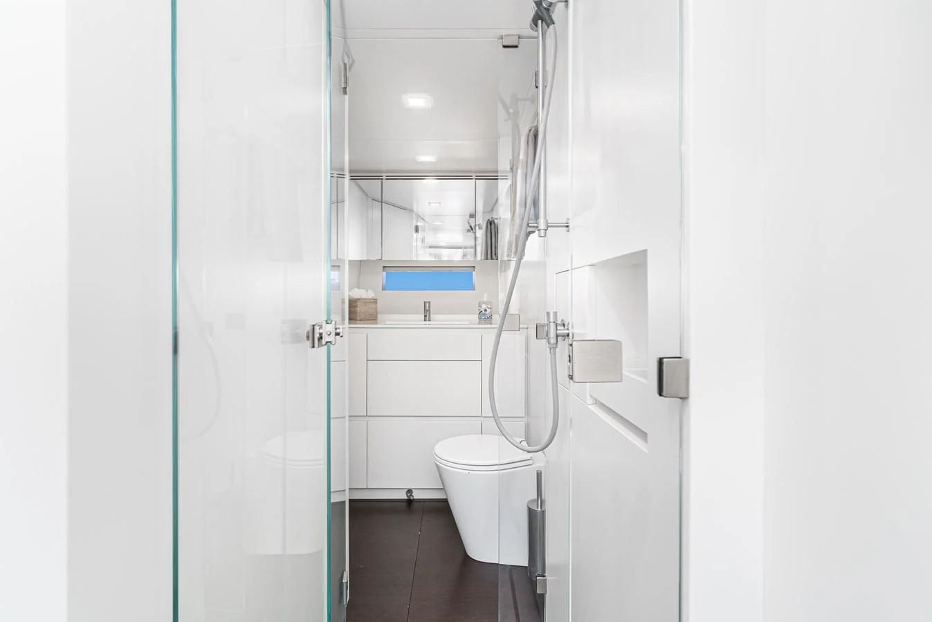 a bathroom with a toilet and a shower aboard AIFOS Yacht for Sale