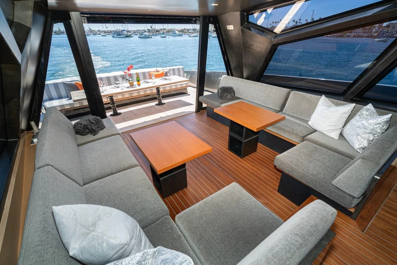 a living room with a large window aboard AIFOS Yacht for Sale