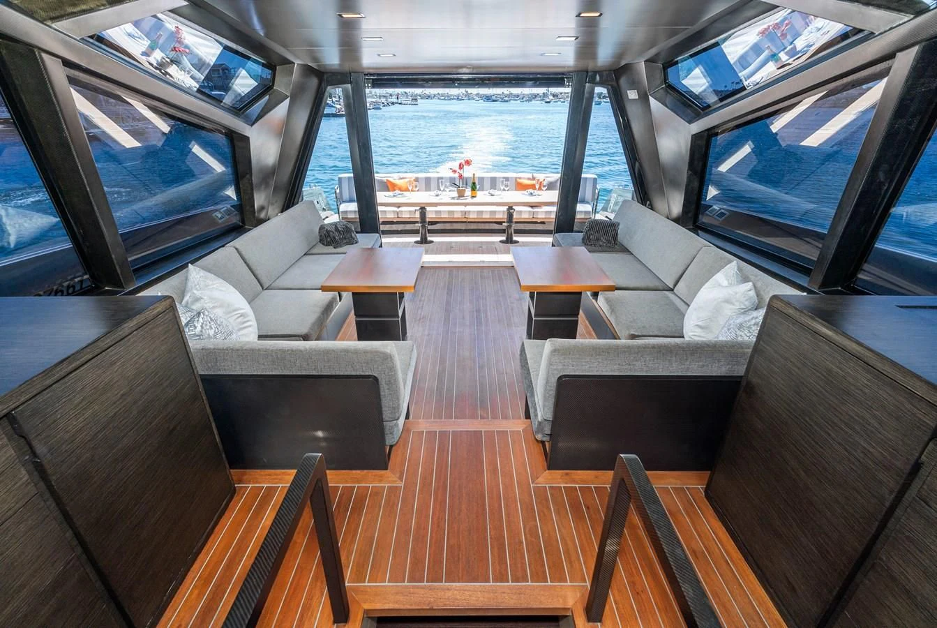 a living room with a large window aboard AIFOS Yacht for Sale