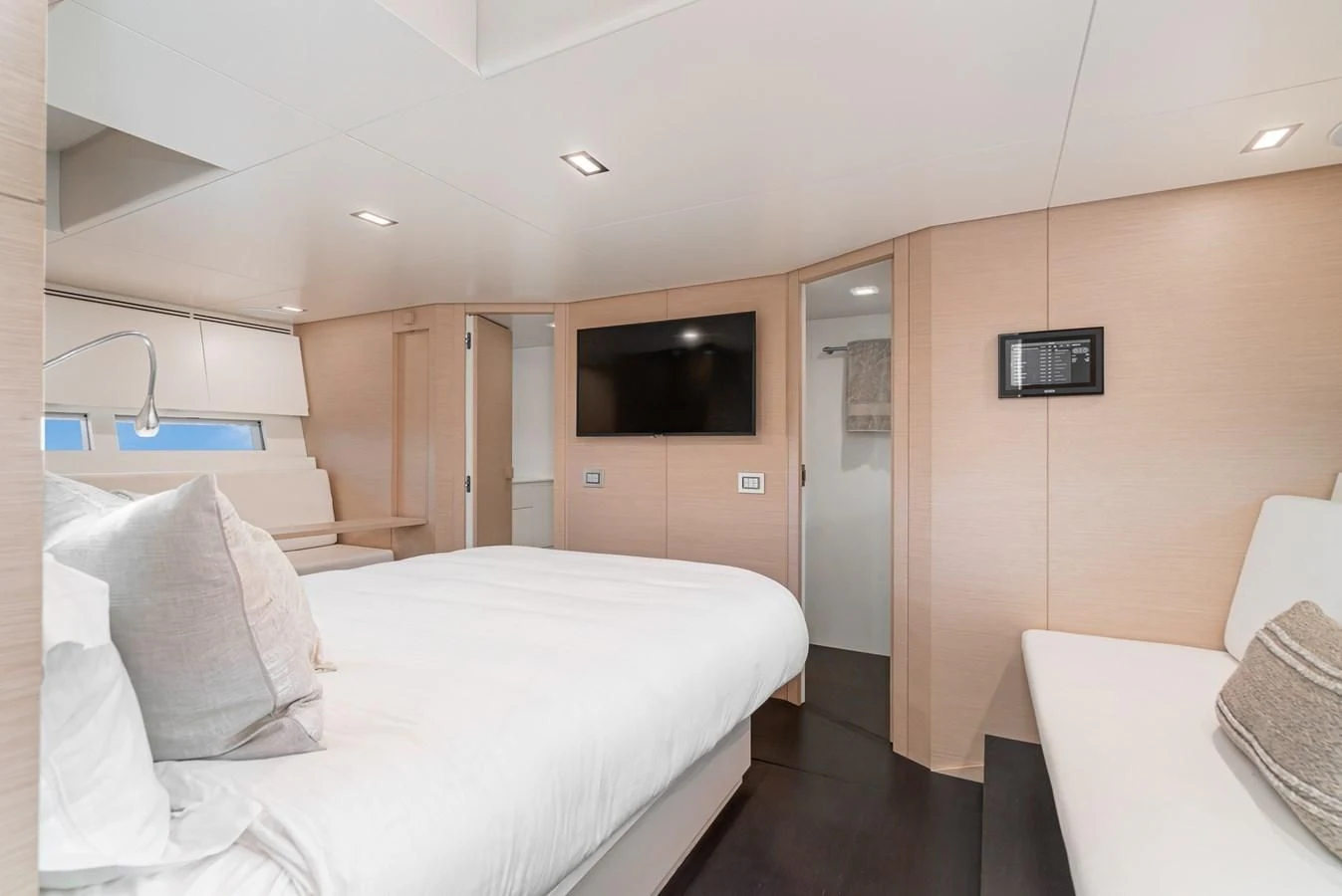 a room with a bed and a television aboard AIFOS Yacht for Sale