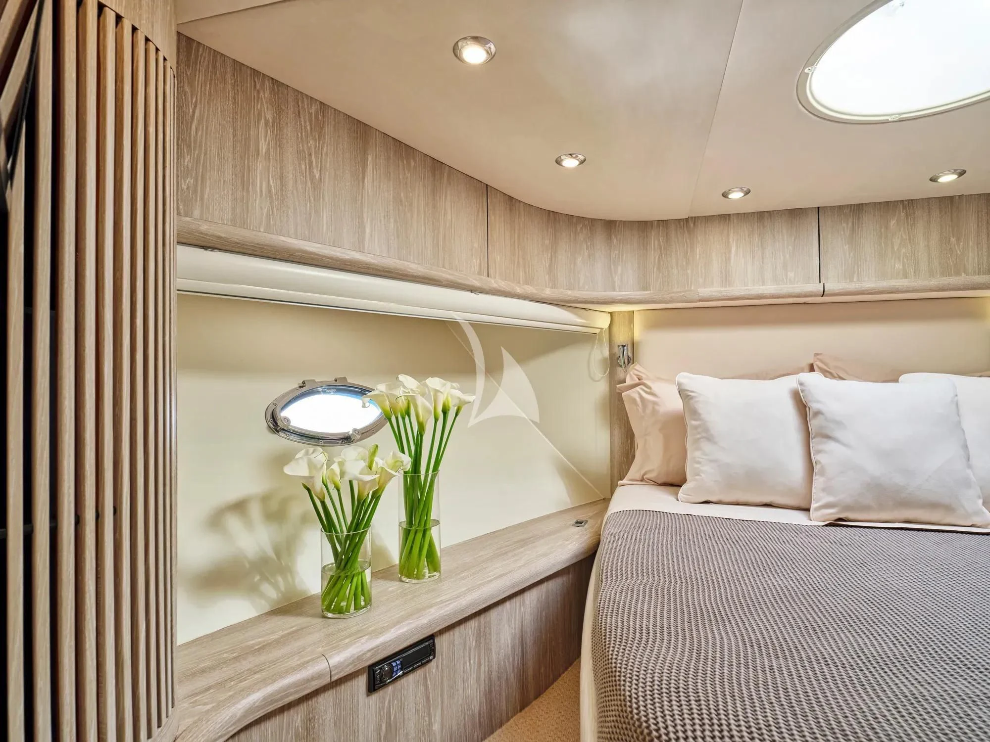 a room with a bed and a desk aboard M FIVE Yacht for Charter