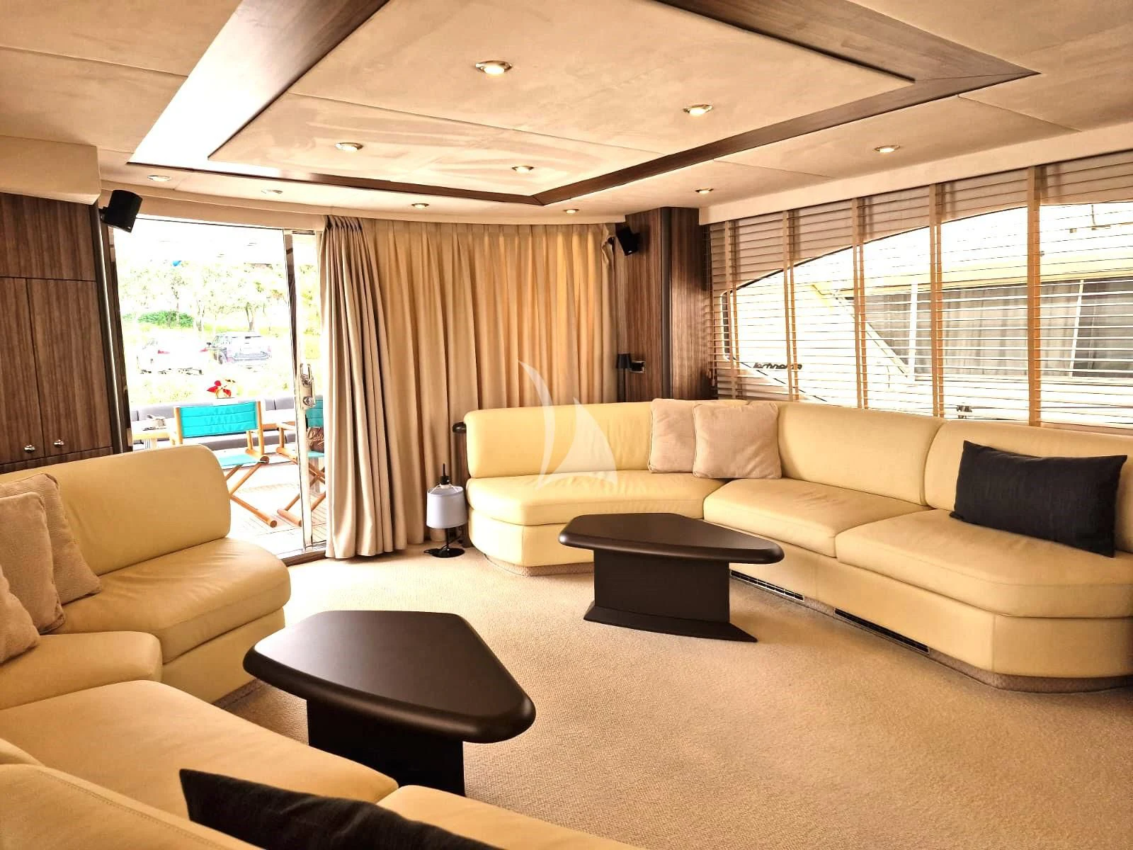 a living room with a couch and a table aboard M FIVE Yacht for Charter