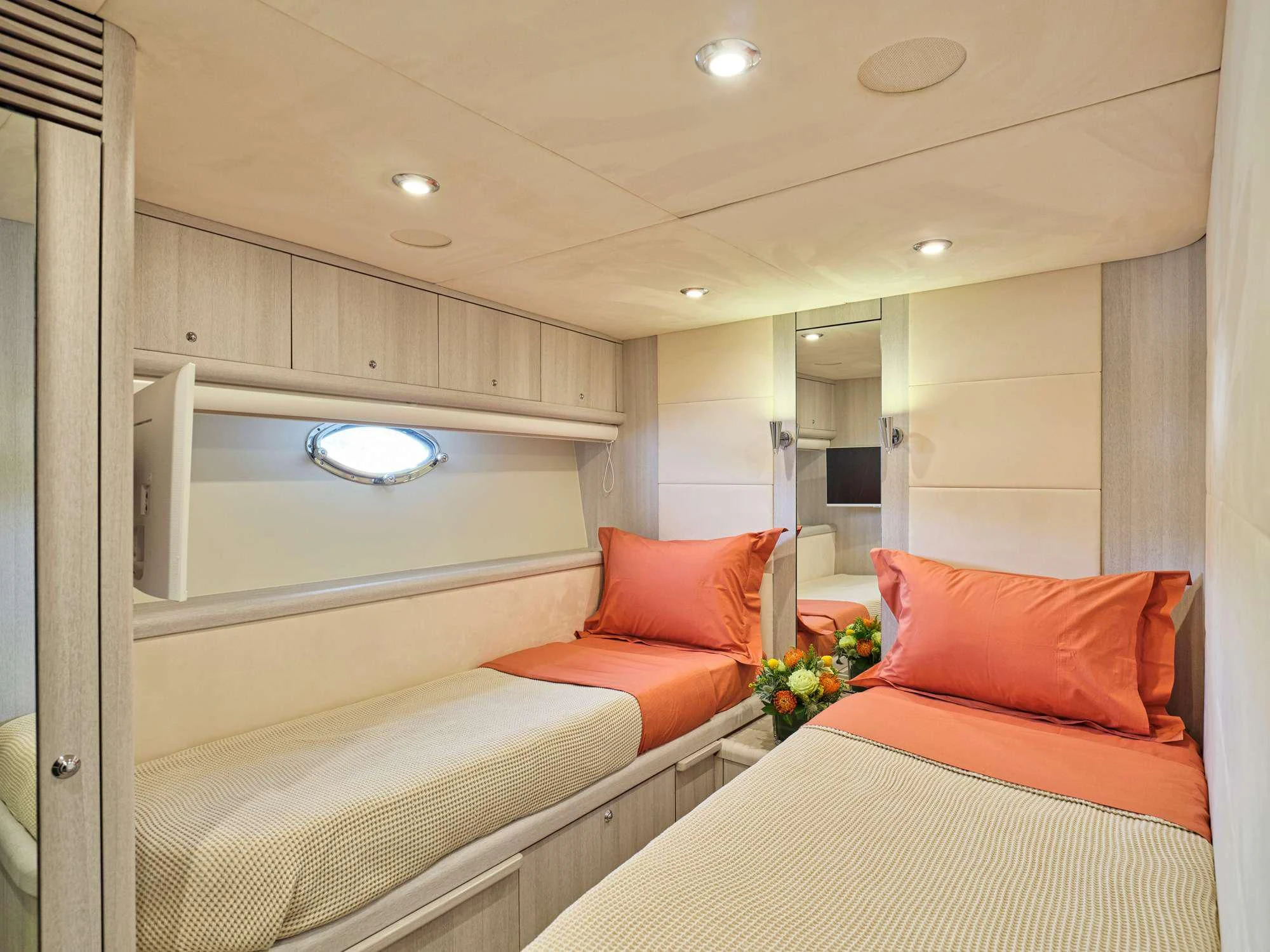 a room with a bed and a mirror aboard M FIVE Yacht for Charter