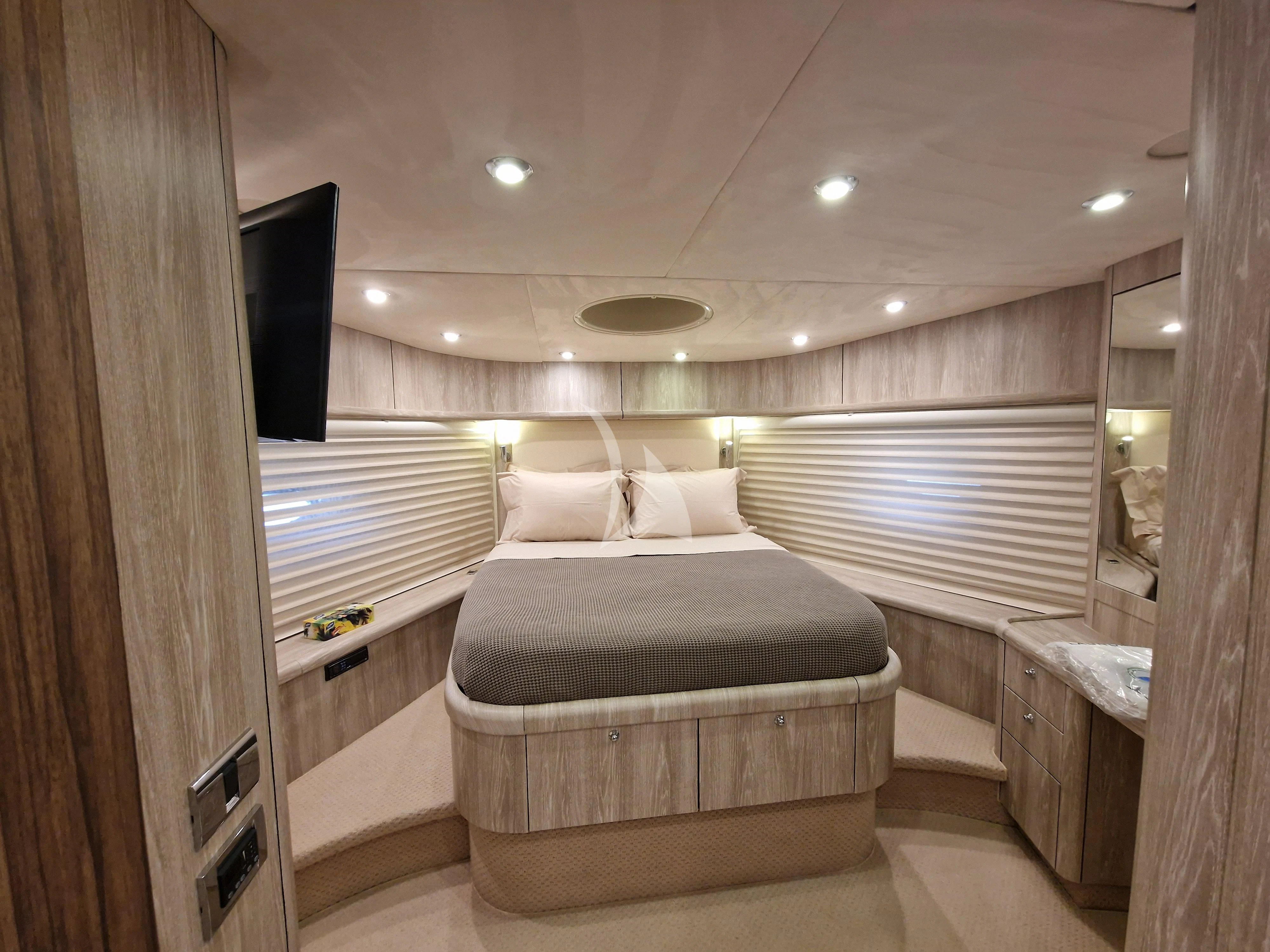 a small bedroom with a bed aboard M FIVE Yacht for Charter