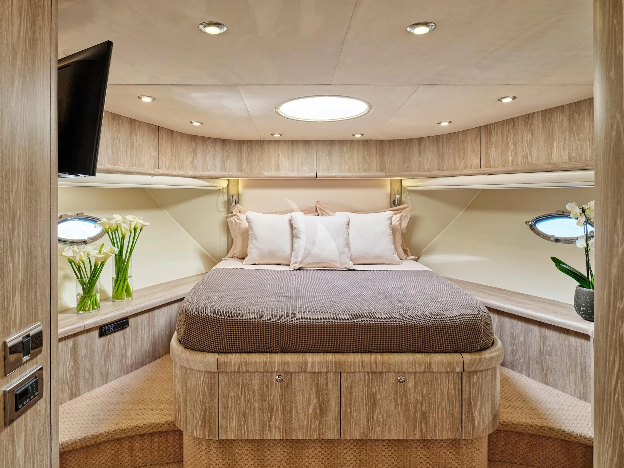 a bed with a purple bed spread aboard M FIVE Yacht for Charter