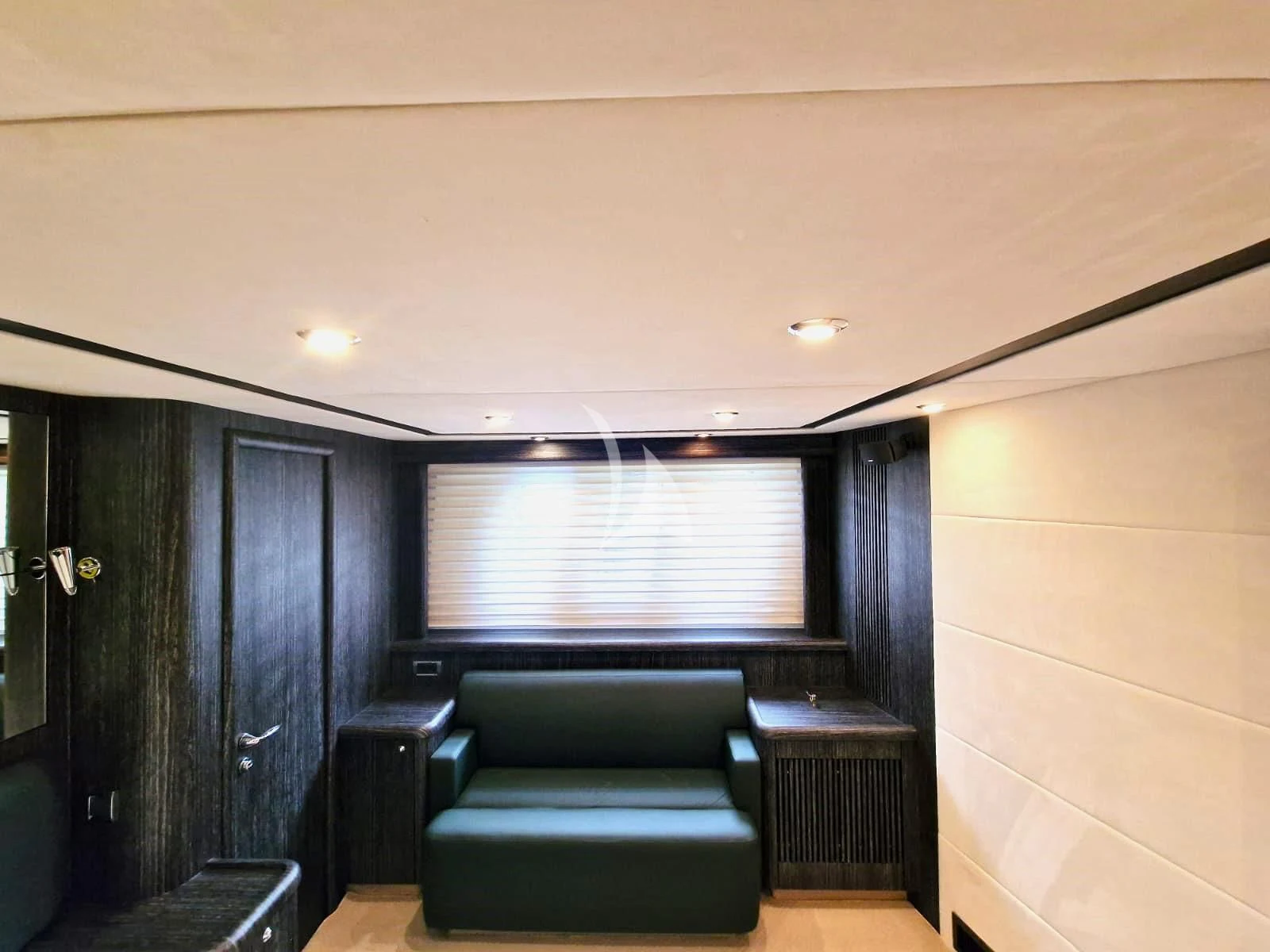 a couch and a television in a room aboard M FIVE Yacht for Charter