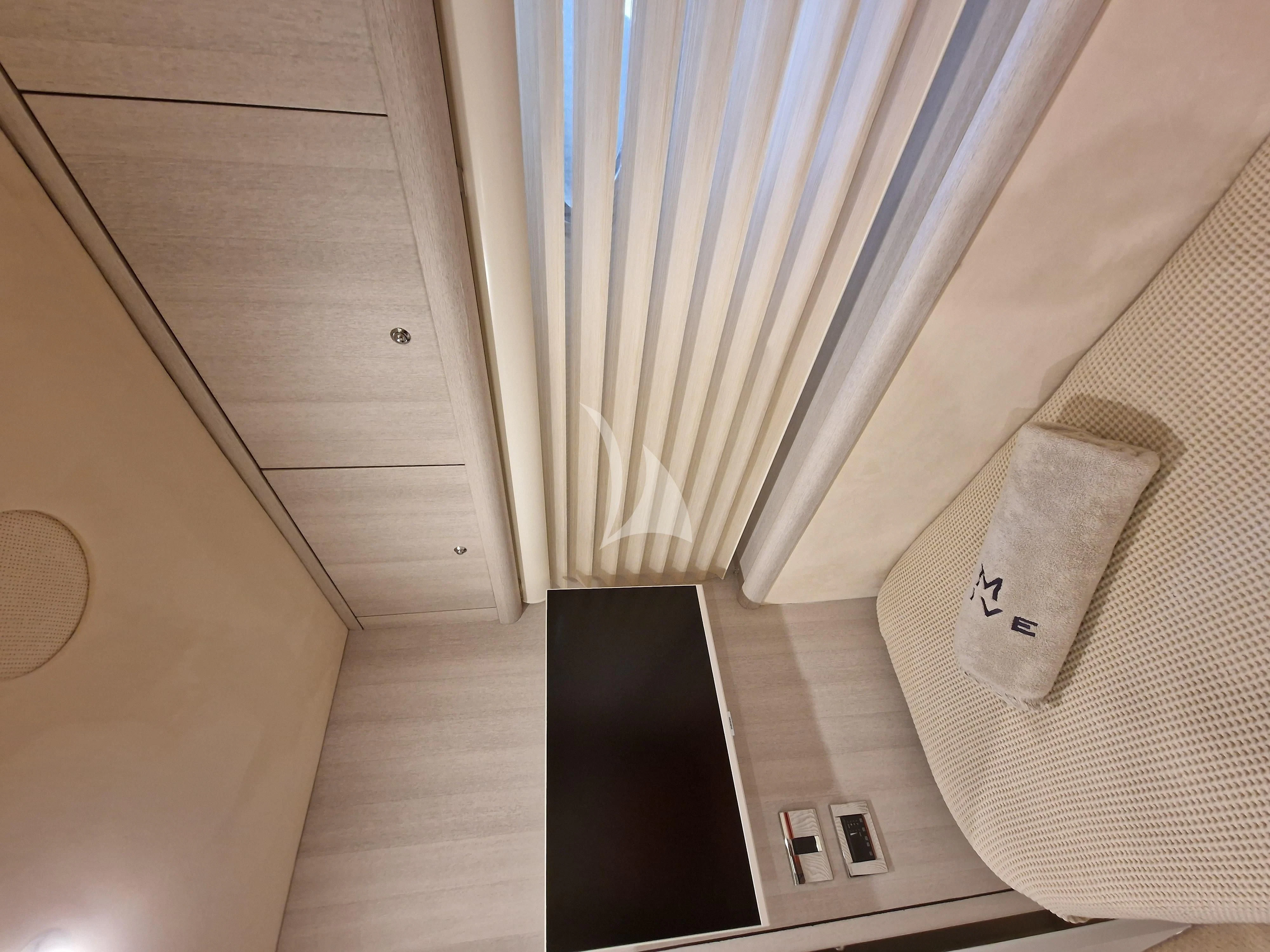 a white curtain and a white pillow aboard M FIVE Yacht for Charter