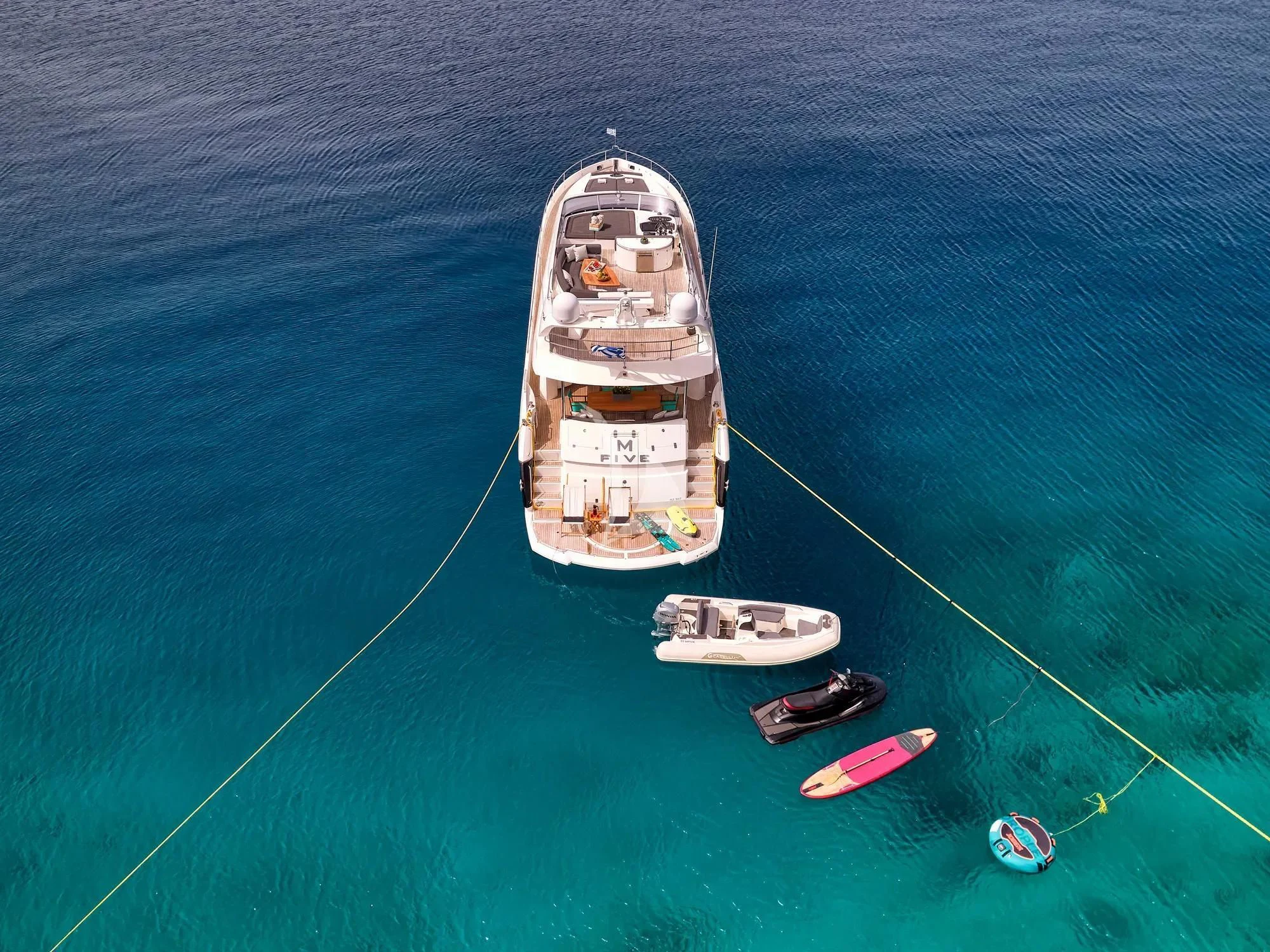 a boat with people on it aboard M FIVE Yacht for Charter